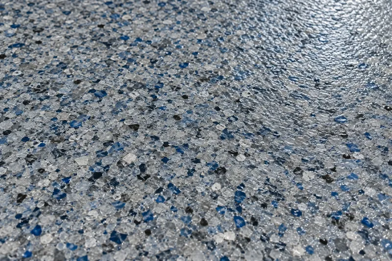 Close-up of a blue and gray quartz epoxy floor